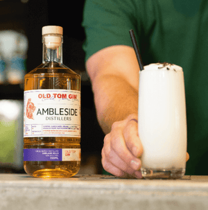 Ramos Gin Fizz presented next to bottle